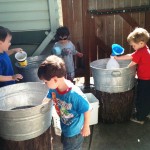 boys at the water buckets