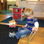 Anthony playing with the fire truck