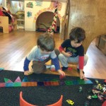 Aiden and Rowan playing cars
