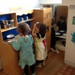 Ava, Daphne, and Rock in the kitchen